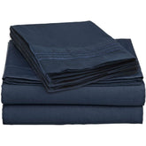 A pile of navy blue sheets with a smooth, folded edge, arranged neatly.